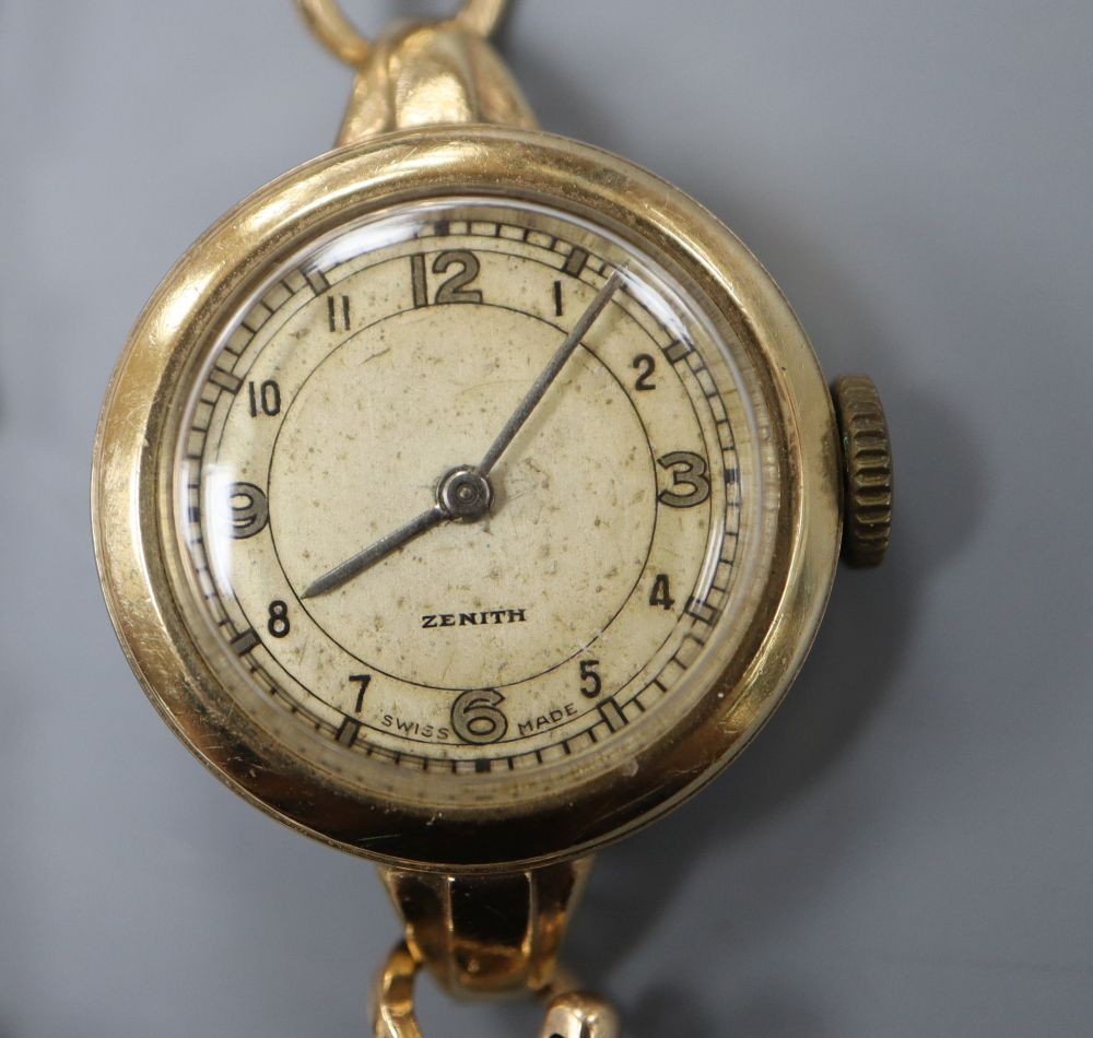 A ladys 1950s 9ct gold Zenith manual wind wrist watch, with case back inscription, gross weight 17.5 grams.